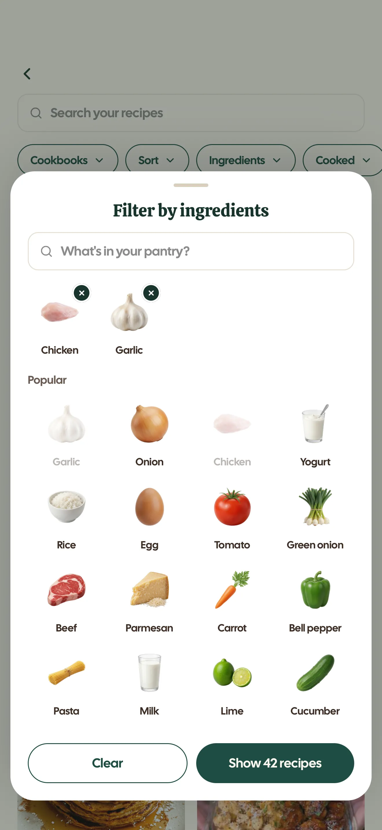 The Filter by ingredients sheet with chicken and garlic selected and a Show 42 recipes button